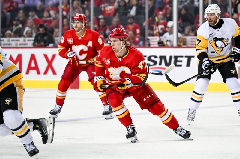 Mar 2, 2024; Calgary, Alberta, CAN; Calgary Flames center Connor Zary (47) skates against the Pittsburgh Penguins during the first period at Scotiabank Saddledome. Mandatory Credit: Brett Holmes-USA TODAY Sports