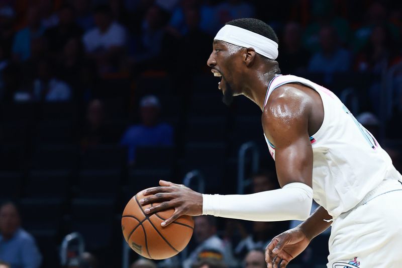 MIAMI, FLORIDA - FEBRUARY 10: Bam Adebayo #13 of the Miami Heat controls the ball against the Boston Celtics at Kaseya Center on February 10, 2025 in Miami, Florida. NOTE TO USER: User expressly acknowledges and agrees that, by downloading and or using this Photograph, user is consenting to the terms and conditions of the Getty Images License Agreement. (Photo by Carmen Mandato/Getty Images)