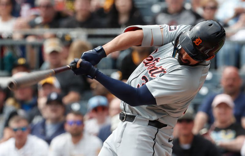 Apr 9, 2024; Pittsburgh, Pennsylvania, USA;  Detroit Tigers left fielder Riley Greene (31) hits a single against the Pittsburgh Pirates during the first inning at PNC Park. Mandatory Credit: Charles LeClaire-USA TODAY Sports