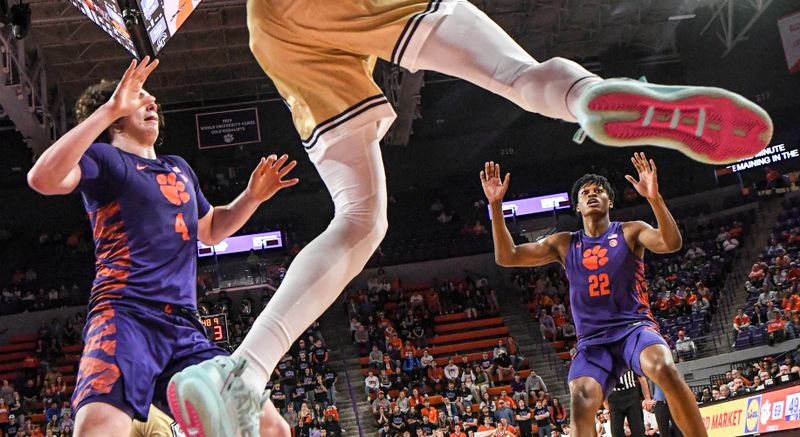 Jan 24, 2023; Clemson, South Carolina, USA; Clemson sophomore forward Ian Schieffelin (4) and Clemson forward RJ Godfrey (22) guard Georgia Tech forward Ja'Von Franklin (4) saving a ball from going out, during the second half at Littlejohn Coliseum. Mandatory Credit: Ken Ruinard-USA TODAY Sports