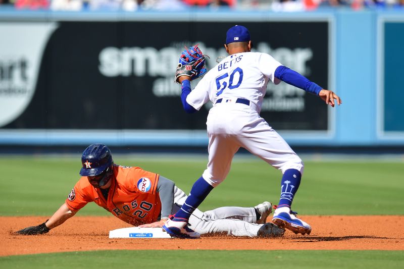 Jun 25, 2023; Los Angeles, California, USA; Houston Astros left fielder Chas McCormick (20) steals second against Los Angeles Dodgers second baseman Mookie Betts (50) at Dodger Stadium. Mandatory Credit: Gary A. Vasquez-USA TODAY Sports