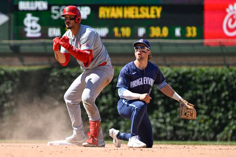 Jun 14, 2024; Chicago, Illinois, USA;  St. Louis Cardinals third base Nolan Arenado (28) reacts after he doubles as Chicago Cubs second base Nico Hoerner (2) looks on during the ninth inning at Wrigley Field. Mandatory Credit: Matt Marton-USA TODAY Sports