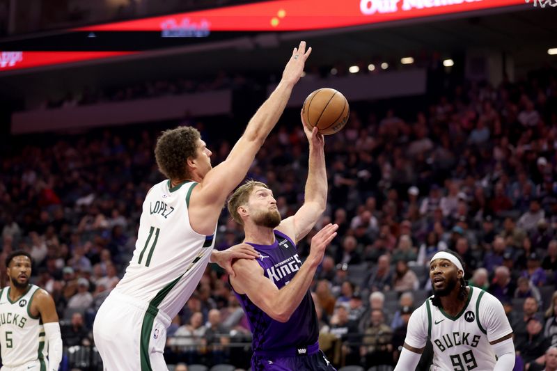 SACRAMENTO, CALIFORNIA - MARCH 12:  Domantas Sabonis #10 of the Sacramento Kings goes up for a dunk on Brook Lopez #11 of the Milwaukee Bucks at Golden 1 Center on March 12, 2024 in Sacramento, California. NOTE TO USER: User expressly acknowledges and agrees that, by downloading and or using this photograph, User is consenting to the terms and conditions of the Getty Images License Agreement.  (Photo by Ezra Shaw/Getty Images)