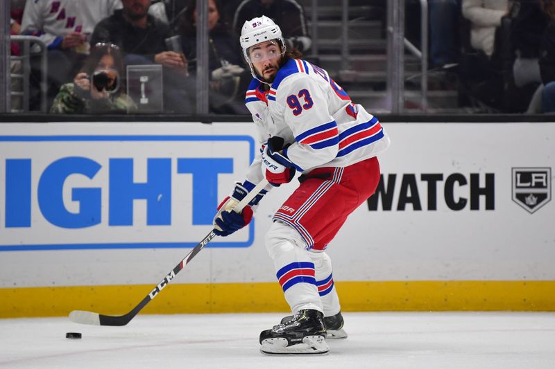 Jan 20, 2024; Los Angeles, California, USA; New York Rangers center Mika Zibanejad (93) controls the puck against the Los Angeles Kings durng the first period at Crypto.com Arena. Mandatory Credit: Gary A. Vasquez-USA TODAY Sports