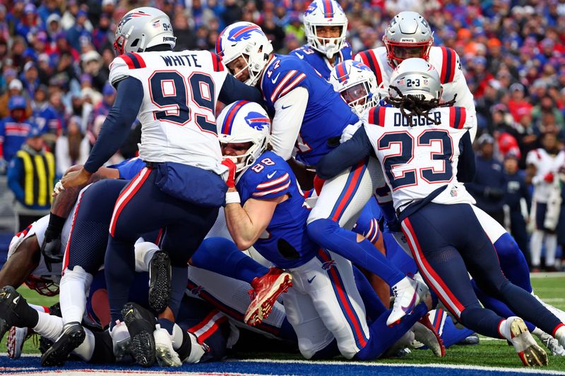 Buffalo Bills quarterback Josh Allen (17) scores a touchdown during the second half of an NFL football game against the New England Patriots in Orchard Park, N.Y., Sunday, Dec. 31, 2023. (AP Photo/Jeffrey T. Barnes )