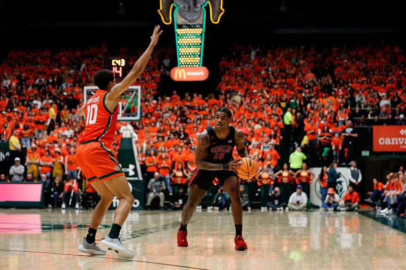 Jan 19, 2024; Fort Collins, Colorado, USA; UNLV Rebels guard Luis Rodriguez (15) controls the ball as Colorado State Rams guard Nique Clifford (10) guards in the first half at Moby Arena. Mandatory Credit: Isaiah J. Downing-USA TODAY Sports