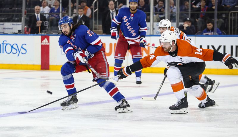 Apr 11, 2024; New York, New York, USA; New York Rangers center Mika Zibanejad (93) passes the puck while Philadelphia Flyers center Sean Couturier (14) defends during the third period at Madison Square Garden. Mandatory Credit: Danny Wild-USA TODAY Sports