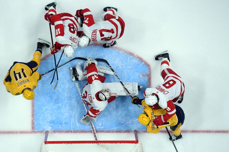 Mar 23, 2024; Nashville, Tennessee, USA; Detroit Red Wings goaltender Alex Lyon (34) makes a save in traffic during the second period against the Nashville Predators at Bridgestone Arena. Mandatory Credit: Christopher Hanewinckel-USA TODAY Sports