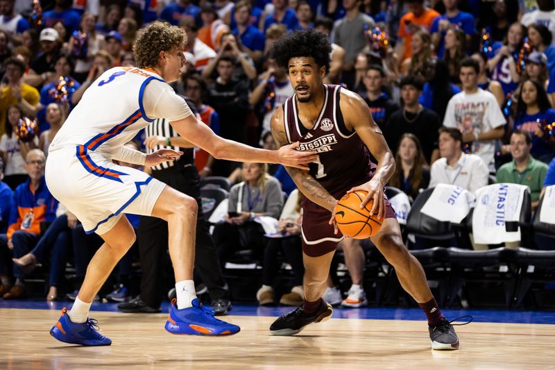 Jan 24, 2024; Gainesville, Florida, USA; Florida Gators center Micah Handlogten (3) defends Mississippi State Bulldogs forward Tolu Smith (1) during the first half at Exactech Arena at the Stephen C. O'Connell Center. Mandatory Credit: Matt Pendleton-USA TODAY Sports