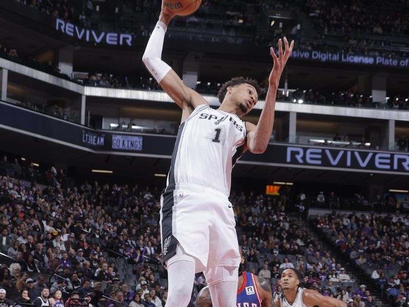 SACRAMENTO, CA - DECEMBER 1: Victor Wembanyama #1 of the San Antonio Spurs goes up for the rebound during the game against the Sacramento Kings on December 1, 2024 at Golden 1 Center in Sacramento, California. NOTE TO USER: User expressly acknowledges and agrees that, by downloading and or using this Photograph, user is consenting to the terms and conditions of the Getty Images License Agreement. Mandatory Copyright Notice: Copyright 2024 NBAE (Photo by Rocky Widner/NBAE via Getty Images)