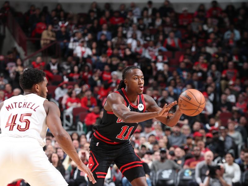 CHICAGO, IL - NOVEMBER 11: Ayo Dosunmu #11 of the Chicago Bulls passes the ball during the game against the Cleveland Cavaliers on November 11, 2024 at United Center in Chicago, Illinois. NOTE TO USER: User expressly acknowledges and agrees that, by downloading and or using this photograph, User is consenting to the terms and conditions of the Getty Images License Agreement. Mandatory Copyright Notice: Copyright 2024 NBAE (Photo by Jeff Haynes/NBAE via Getty Images)