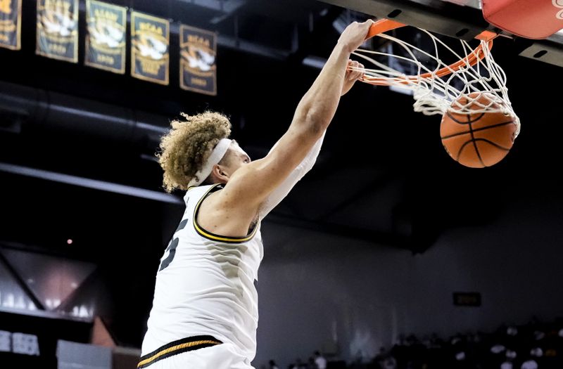 Mar 4, 2023; Columbia, Missouri, USA; Missouri Tigers forward Noah Carter (35) dunks against the Mississippi Rebels during the first half at Mizzou Arena. Mandatory Credit: Denny Medley-USA TODAY Sports