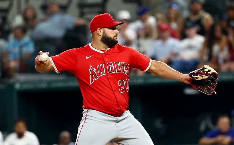 Aug 27, 2025; Arlington, Texas, USA;  Los Angeles Angels outfielder Niko Kavadas (20) pitches during the seventh inning against the Texas Rangers at Globe Life Field. Mandatory Credit: Kevin Jairaj-Imagn Images