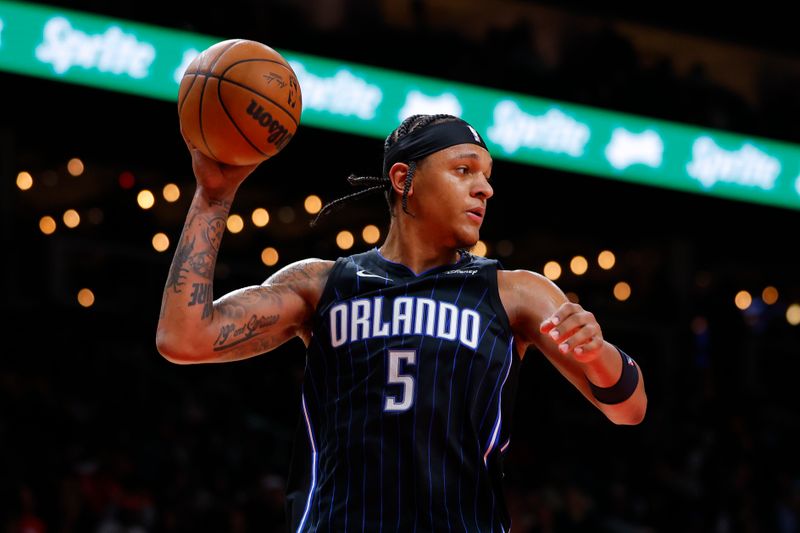 ATLANTA, GEORGIA - JANUARY 17: Paolo Banchero #5 of the Orlando Magic looks to pass after a rebound during the third quarter against the Atlanta Hawks at State Farm Arena on January 17, 2024 in Atlanta, Georgia. NOTE TO USER: User expressly acknowledges and agrees that, by downloading and or using this photograph, User is consenting to the terms and conditions of the Getty Images License Agreement. (Photo by Todd Kirkland/Getty Images)