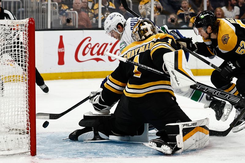 Nov 26, 2024; Boston, Massachusetts, USA; Vancouver Canucks left wing Jake DeBrusk (74) scores on Boston Bruins goaltender Jeremy Swayman (1) during the second period at TD Garden. Mandatory Credit: Winslow Townson-Imagn Images