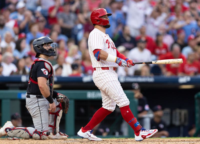 Jul 27, 2024; Philadelphia, Pennsylvania, USA;  Philadelphia Phillies designated hitter Kyle Schwarber (12) hits a two RBI home run during the fourth innin against the Cleveland Guardians at Citizens Bank Park. Mandatory Credit: Bill Streicher-USA TODAY Sports