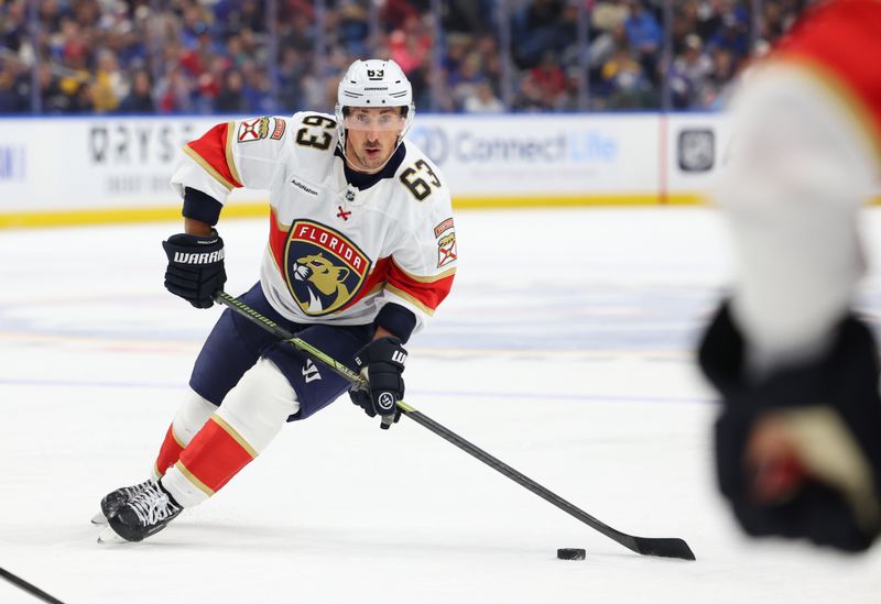 Oct 18, 2025; Buffalo, New York, USA;  Florida Panthers left wing Brad Marchand (63) looks to pass during the first period against the Buffalo Sabres at KeyBank Center. Mandatory Credit: Timothy T. Ludwig-Imagn Images
