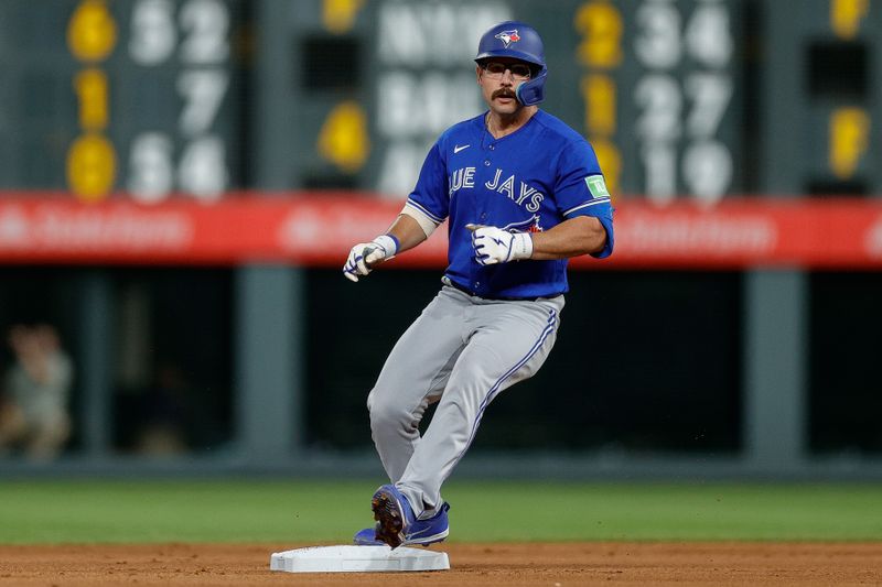 Sep 1, 2023; Denver, Colorado, USA; Toronto Blue Jays third baseman Davis Schneider (36) reaches second on an RBI double in the seventh inning against the Colorado Rockies at Coors Field. Mandatory Credit: Isaiah J. Downing-USA TODAY Sports