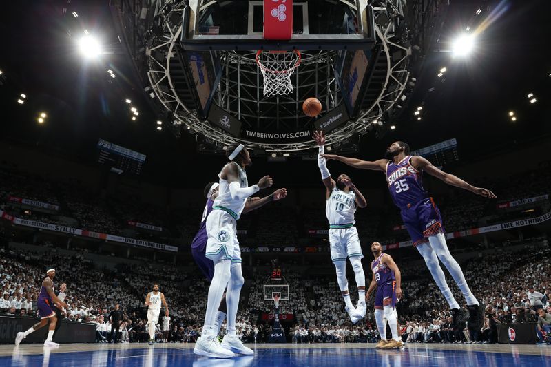 MINNEAPOLIS, MN -  APRIL 20: Mike Conley #10 of the Minnesota Timberwolves drives to the basket during the game against the Phoenix Suns during Round 1 Game 1 of the 2024 NBA Playoffs on April 20, 2024 at Target Center in Minneapolis, Minnesota. NOTE TO USER: User expressly acknowledges and agrees that, by downloading and or using this Photograph, user is consenting to the terms and conditions of the Getty Images License Agreement. Mandatory Copyright Notice: Copyright 2024 NBAE (Photo by David Sherman/NBAE via Getty Images)