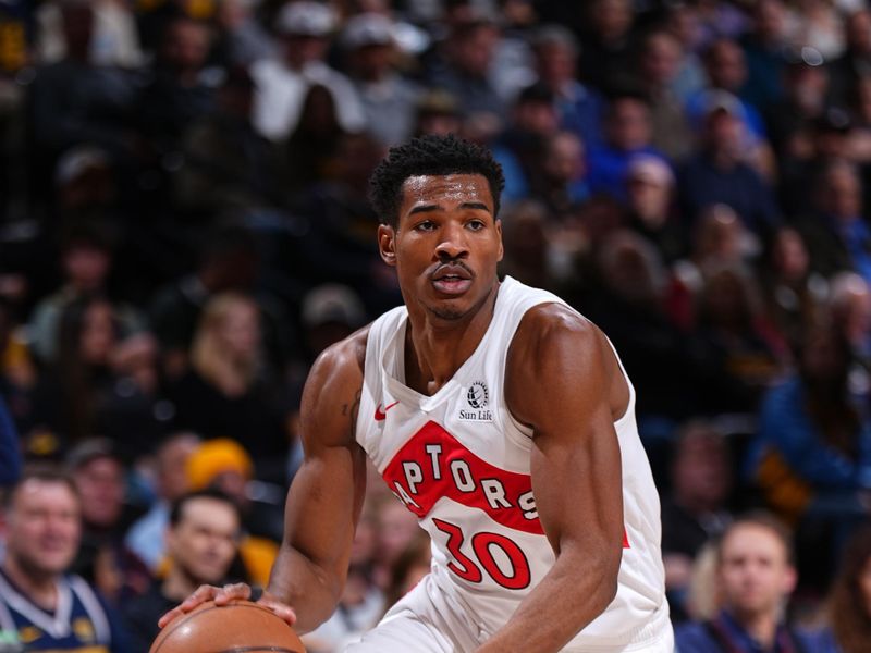 DENVER, CO - MARCH 11: Ochai Agbaji #30 of the Toronto Raptors handles the ball during the game against the Denver Nuggets on March 11, 2024 at the Ball Arena in Denver, Colorado. NOTE TO USER: User expressly acknowledges and agrees that, by downloading and/or using this Photograph, user is consenting to the terms and conditions of the Getty Images License Agreement. Mandatory Copyright Notice: Copyright 2024 NBAE (Photo by Garrett Ellwood/NBAE via Getty Images)