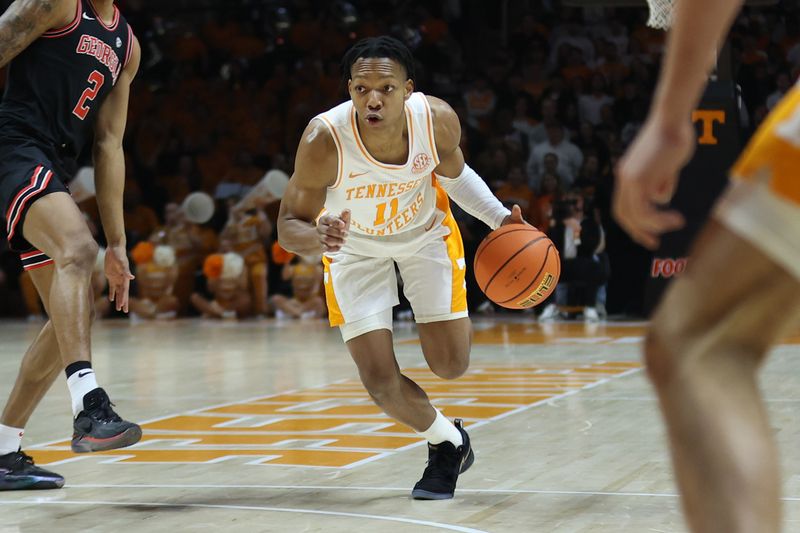 Jan 15, 2025; Knoxville, Tennessee, USA; Tennessee Volunteers guard Jordan Gainey (11) dribbles against the Georgia Bulldogs during the first half at Thompson-Boling Arena at Food City Center. Mandatory Credit: Randy Sartin-Imagn Images