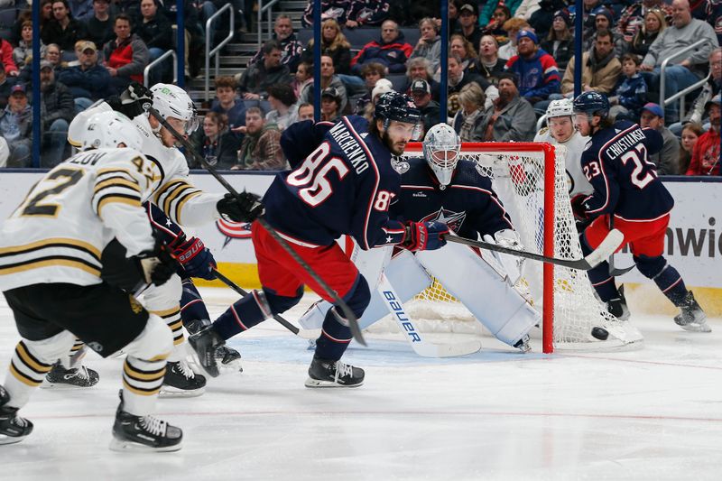 Jan 2, 2024; Columbus, Ohio, USA; Columbus Blue Jackets right wing Kirill Marchenko (86) clears a rebound against the Boston Bruins during the second period at Nationwide Arena. Mandatory Credit: Russell LaBounty-USA TODAY Sports