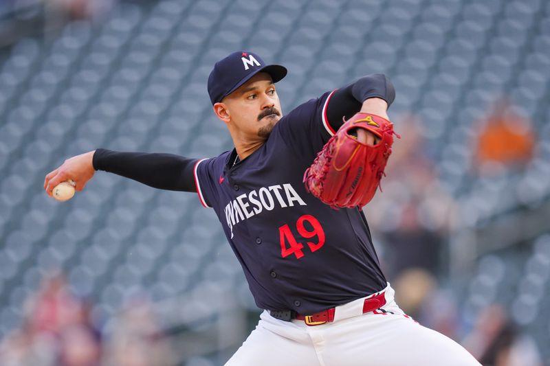 Jun 18, 2024; Minneapolis, Minnesota, USA; Minnesota Twins pitcher Pablo López (49) pitches against the Tampa Bay Rays in the first inning at Target Field. Mandatory Credit: Brad Rempel-USA TODAY Sports