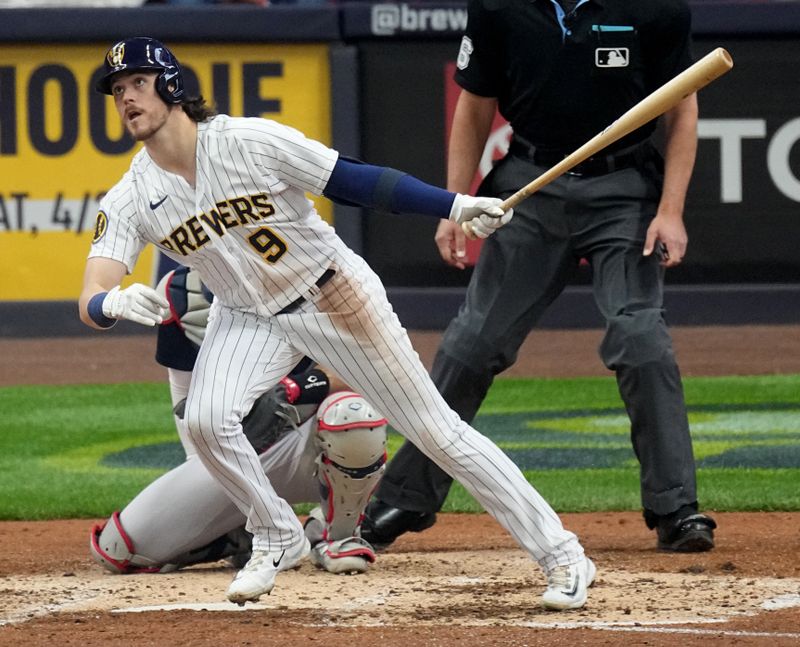 Apr 23, 2023; Milwaukee, Wisconsin, USA; Milwaukee Brewers third baseman Brian Anderson (9) hits a solo home run off against the Boston Red Sox during the fourth inning at American Family Field. Mandatory Credit: Mark Hoffman-USA TODAY Sports