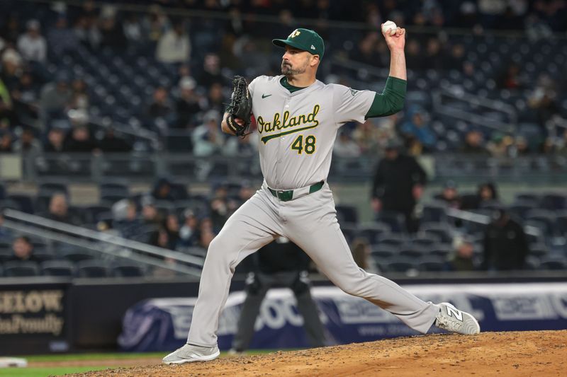 Apr 25, 2024; Bronx, New York, USA; Oakland Athletics relief pitcher T.J. McFarland (48) delivers a pitch during the eighth inning against the New York Yankees at Yankee Stadium. Mandatory Credit: Vincent Carchietta-USA TODAY Sports