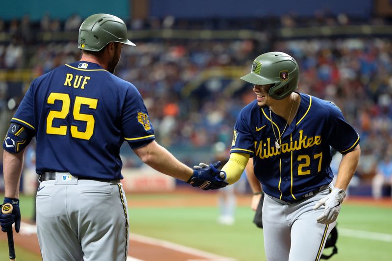 May 21, 2023; St. Petersburg, Florida, USA;  Milwaukee Brewers designated hitter Darin Ruf (25) congratulates shortstop Willy Adames (27) after hitting a home runagainst the Tampa Bay Rays in the second inning at Tropicana Field. Mandatory Credit: Nathan Ray Seebeck-USA TODAY Sports