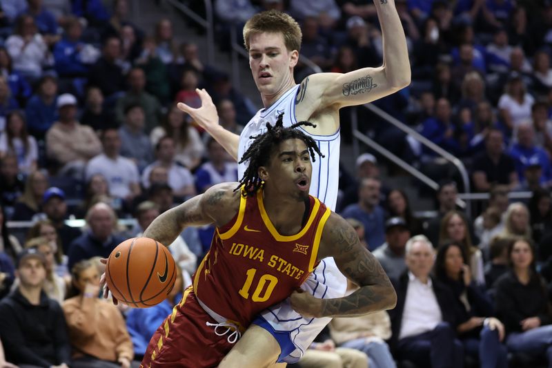 Jan 16, 2024; Provo, Utah, USA; Iowa State Cyclones guard Keshon Gilbert (10) drives to the basket against Brigham Young Cougars forward Noah Waterman (0) during the second half at Marriott Center. Mandatory Credit: Rob Gray-USA TODAY Sports