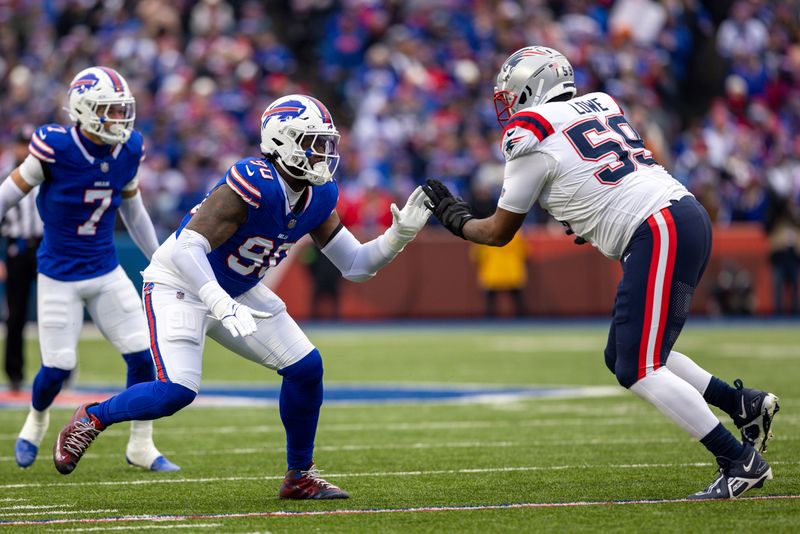 Buffalo Bills defensive end Shaq Lawson (90) defends against New England Patriots offensive tackle Vederian Lowe (59) during an NFL football game, Sunday, Dec. 31, 2023, in Orchard Park, NY. (AP Photo/Matt Durisko)