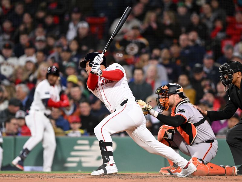 Apr 30, 2024; Boston, Massachusetts, USA; Boston Red Sox right fielder Rob Refsnyder (30) hits a RBI single against the San Francisco Giants during the third inning at Fenway Park. Mandatory Credit: Brian Fluharty-USA TODAY Sports