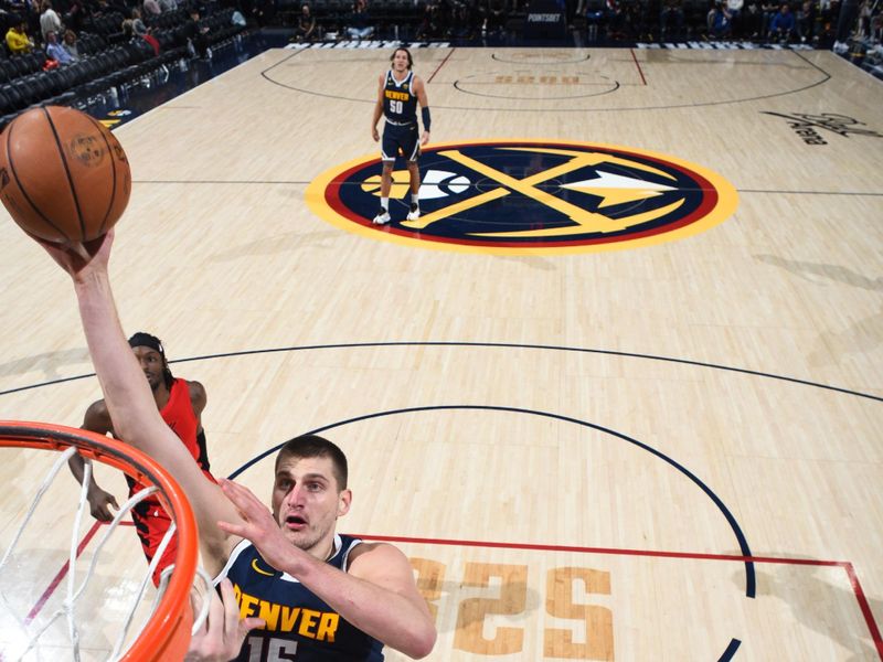 DENVER, CO - JANUARY 17: Nikola Jokic #15 of the Denver Nuggets drives to the basket during the game against the Portland Trail Blazers on January 17, 2023 at the Ball Arena in Denver, Colorado. NOTE TO USER: User expressly acknowledges and agrees that, by downloading and/or using this Photograph, user is consenting to the terms and conditions of the Getty Images License Agreement. Mandatory Copyright Notice: Copyright 2023 NBAE (Photo by Garrett Ellwood/NBAE via Getty Images)