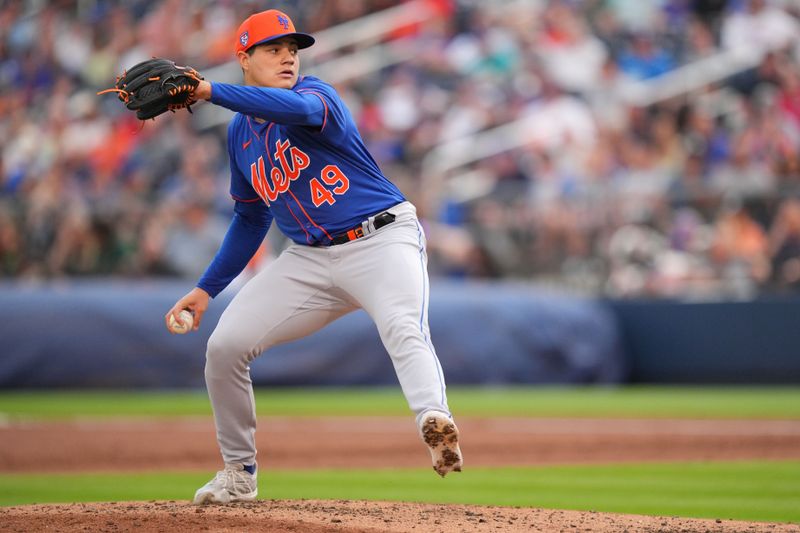 Mar 16, 2024; West Palm Beach, Florida, USA;  New York Mets relief pitcher Yacksel Rios (49) pitches in the third inning against the Houston Astros at CACTI Park of the Palm Beaches. Mandatory Credit: Jim Rassol-USA TODAY Sports
