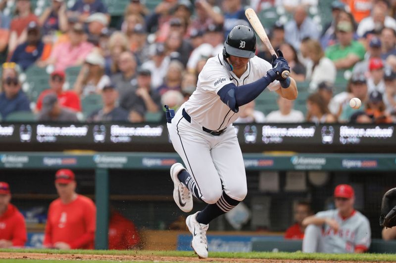 Aug 29, 2024; Detroit, Michigan, USA;  Detroit Tigers second base Jace Jung (17) is hit by a pitch in the third inning against the Los Angeles Angels at Comerica Park. Mandatory Credit: Rick Osentoski-USA TODAY Sports