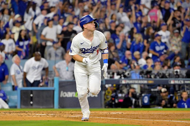 Oct 20, 2024; Los Angeles, California, USA; Los Angeles Dodgers catcher Will Smith (16) runs after hitting a two run home run in the third inning against the New York Mets during game six of the NLCS for the 2024 MLB playoffs at Dodger Stadium. Mandatory Credit: Jayne Kamin-Oncea-Imagn Images