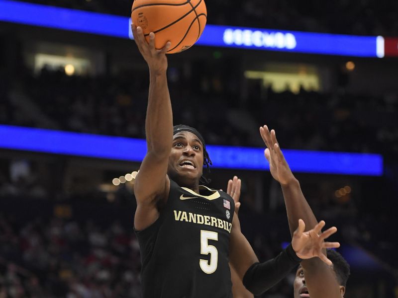 Mar 11, 2023; Nashville, TN, USA;  Vanderbilt Commodores guard Ezra Manjon (5) shoots the ball against the Vanderbilt Commodores during the first half at Bridgestone Arena. Mandatory Credit: Steve Roberts-USA TODAY Sports