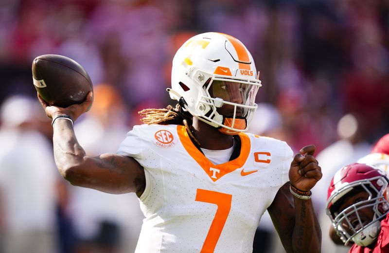 Oct 21, 2023; Tuscaloosa, Alabama, USA; Tennessee Volunteers quarterback Joe Milton III (7) passing against the Alabama Crimson Tide during the first half at Bryant-Denny Stadium. Mandatory Credit: John David Mercer-USA TODAY Sports