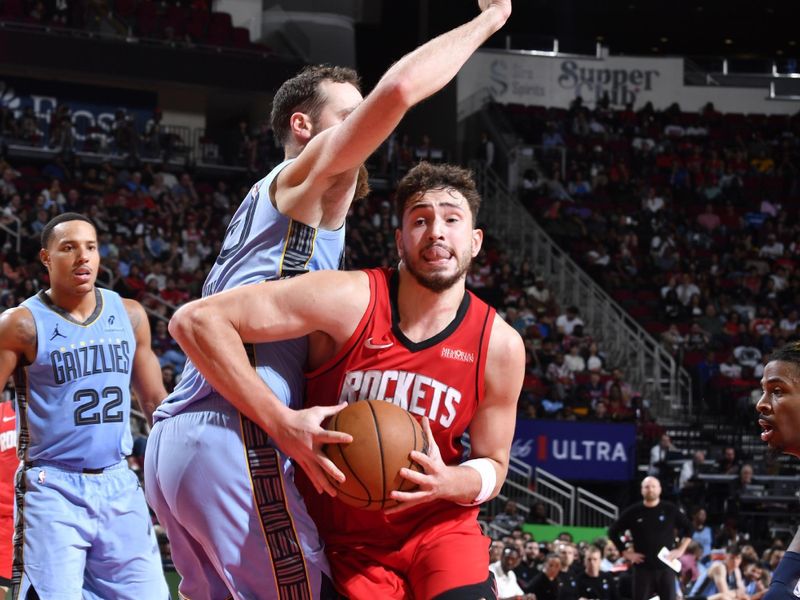 HOUSTON, TX - OCTOBER 25: Alperen Sengun #28 of the Houston Rockets drives to the basket during the game against the Memphis Grizzlies on October 25, 2024 at the Toyota Center in Houston, Texas. NOTE TO USER: User expressly acknowledges and agrees that, by downloading and or using this photograph, User is consenting to the terms and conditions of the Getty Images License Agreement. Mandatory Copyright Notice: Copyright 2024 NBAE (Photo by Logan Riely/NBAE via Getty Images)