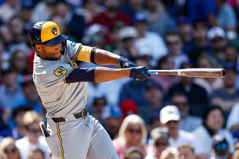 May 3, 2024; Chicago, Illinois, USA; Milwaukee Brewers outfielder Jackson Chourio (11) singles against the Chicago Cubs during the eight inning at Wrigley Field. Mandatory Credit: Kamil Krzaczynski-USA TODAY Sports