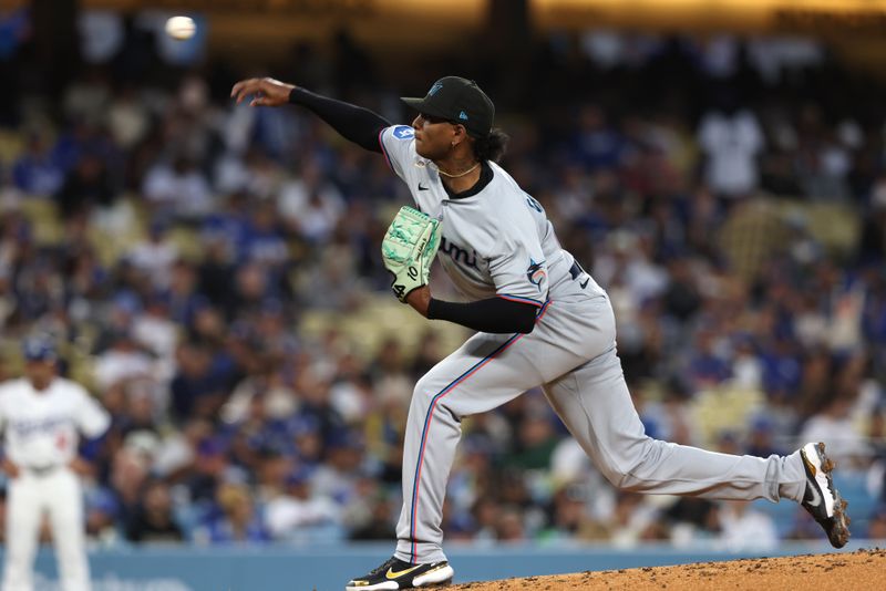 Apr 28, 2025; Los Angeles, California, USA; Miami Marlins pitcher Edward Cabrera (27) pitches in the second inning against the Los Angeles Dodgers at Dodger Stadium. Mandatory Credit: Jason Parkhurst-Imagn Images