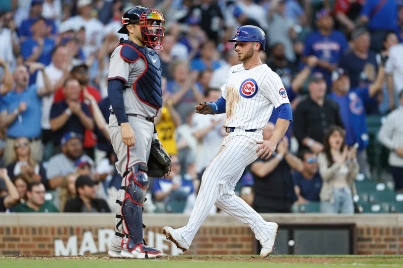 May 21, 2024; Chicago, Illinois, USA; Chicago Cubs first baseman Michael Busch (29) scores against the Atlanta Braves during the second inning at Wrigley Field. Mandatory Credit: Kamil Krzaczynski-USA TODAY Sports