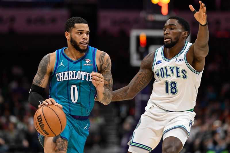 CHARLOTTE, NORTH CAROLINA - DECEMBER 02: Miles Bridges #0 of the Charlotte Hornets drives to the basket against Shake Milton #18 of the Minnesota Timberwolves during the first half of their game at Spectrum Center on December 02, 2023 in Charlotte, North Carolina. NOTE TO USER: User expressly acknowledges and agrees that, by downloading and or using this photograph, User is consenting to the terms and conditions of the Getty Images License Agreement.?  (Photo by Matt Kelley/Getty Images)