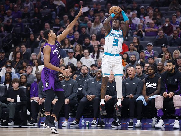 SACRAMENTO, CALIFORNIA - JANUARY 02: Terry Rozier #3 of the Charlotte Hornets shoots the ball against Keegan Murray #13 of the Sacramento Kings in the first quarter at Golden 1 Center on January 02, 2024 in Sacramento, California. NOTE TO USER: User expressly acknowledges and agrees that, by downloading and or using this photograph, User is consenting to the terms and conditions of the Getty Images License Agreement. (Photo by Lachlan Cunningham/Getty Images)