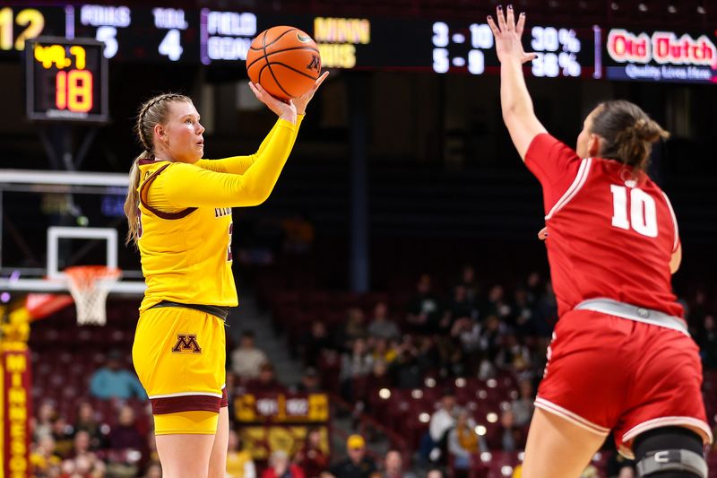 Feb 20, 2024; Minneapolis, Minnesota, USA; Minnesota Golden Gophers guard Grace Grocholski (25) shoots as Wisconsin Badgers guard Halle Douglass (10) defends during the first half at Williams Arena. Mandatory Credit: Matt Krohn-USA TODAY Sports