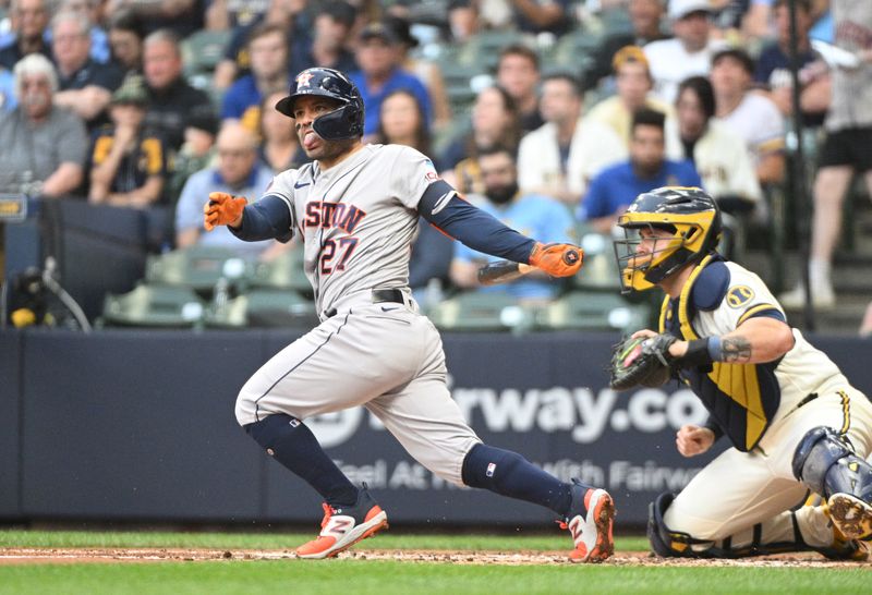 May 23, 2023; Milwaukee, Wisconsin, USA; Houston Astros second baseman Jose Altuve (27) beats out the throw to first base on an infielder grounder against the Milwaukee Brewers  at American Family Field. Mandatory Credit: Michael McLoone-USA TODAY Sports