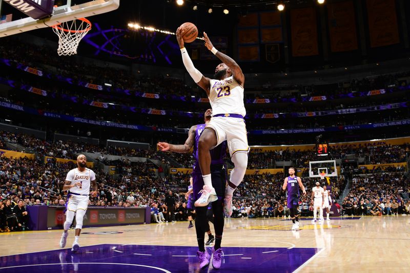 LOS ANGELES, CA - OCTOBER 26: LeBron James #23 of the Los Angeles Lakers drives to the basket during the game against the Sacramento Kings on October 26, 2024 at Crypto.Com Arena in Los Angeles, California. NOTE TO USER: User expressly acknowledges and agrees that, by downloading and/or using this Photograph, user is consenting to the terms and conditions of the Getty Images License Agreement. Mandatory Copyright Notice: Copyright 2024 NBAE (Photo by Adam Pantozzi/NBAE via Getty Images)