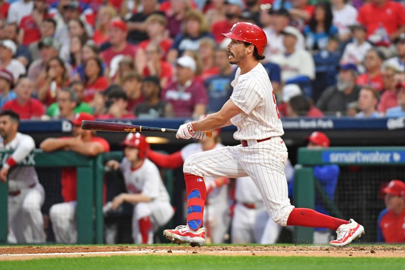 Jun 2, 2024; Philadelphia, Pennsylvania, USA; Philadelphia Phillies catcher Garrett Stubbs (21) hits an RBI single against the St. Louis Cardinals during the second inning at Citizens Bank Park. Mandatory Credit: Eric Hartline-USA TODAY Sports