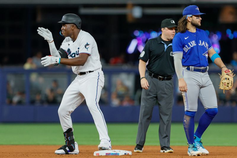 Jun 19, 2023; Miami, Florida, USA; Miami Marlins right fielder Jesus Sanchez (7) reacts from second base after hitting a double against the Toronto Blue Jays during the seventh inning at loanDepot Park. Mandatory Credit: Sam Navarro-USA TODAY Sports